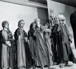Rohit Bal takes a final bow at the end of his fashion show in New Delhi, 1996, highlighting his role as a leading designer for both men's and women's fashion in India.