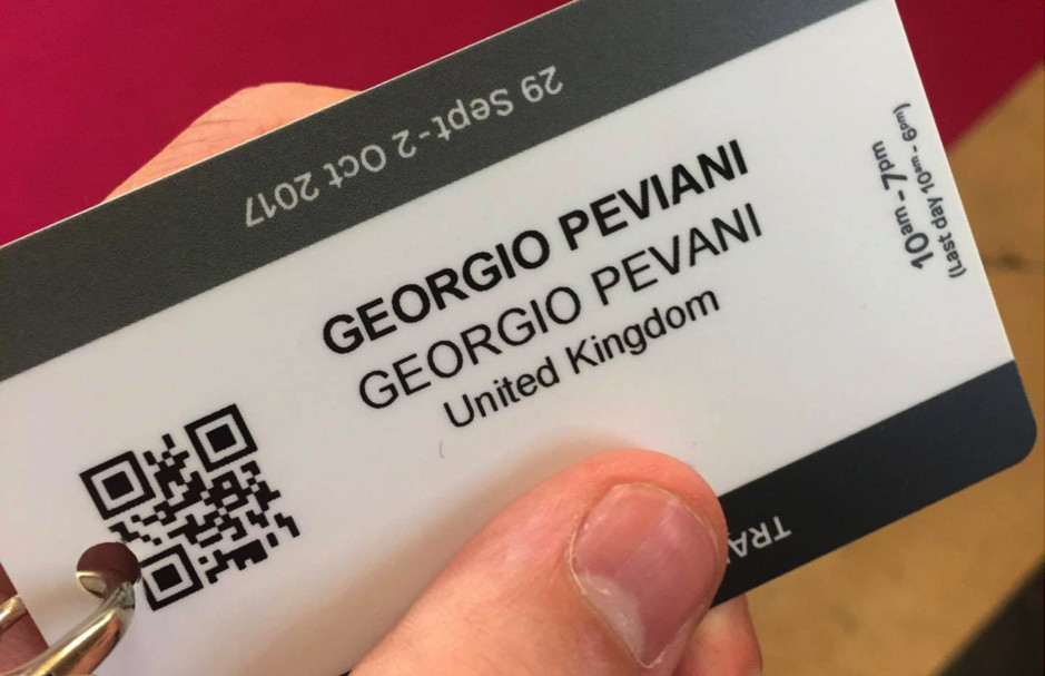 The author holding a Georgio Peviani business card.