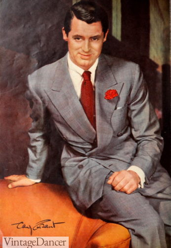 Cary Grant, a style icon of the 1940s, wearing a grey suit with a red carnation boutonniere and tie, showcasing sophisticated 1940s mens fashion in 1941