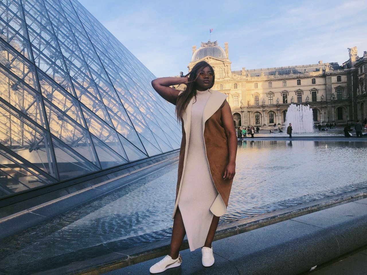 Fashion week outfit featuring a cream Puma South Africa sneaker and a jersey dress.