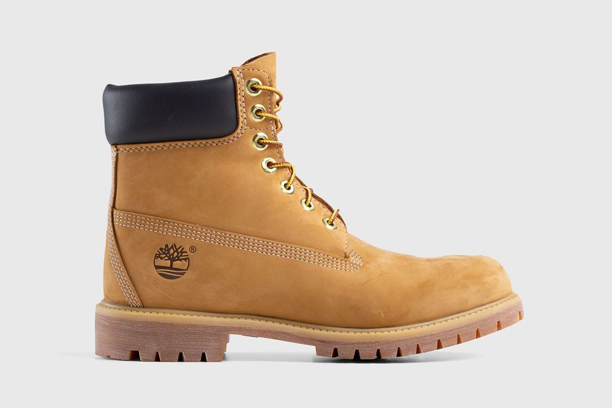 A pair of classic tan Timberland boots on a white background.