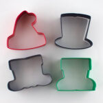 Four cookie cutters from a Wilton Christmas set.