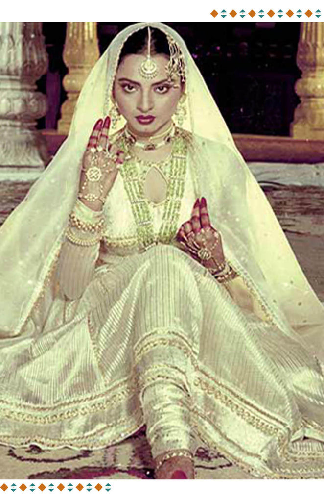 Bollywood actress in a knee-length Anarkali suit, a popular 70s Bollywood fashion style