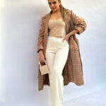 Woman in a classic beige trench coat