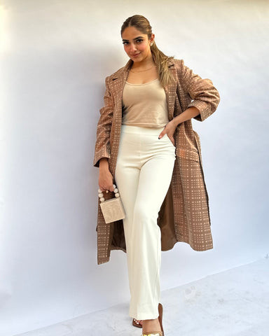 Woman in a classic beige trench coat