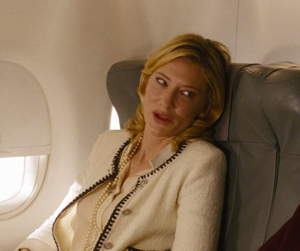 Cate Blanchett in Blue Jasmine wearing a white Chanel jacket and carrying a Hermes Birkin.