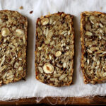 A loaf of bread with seeds and nuts.