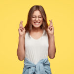 Teenage girl smiling confidently in a stylish outfit.