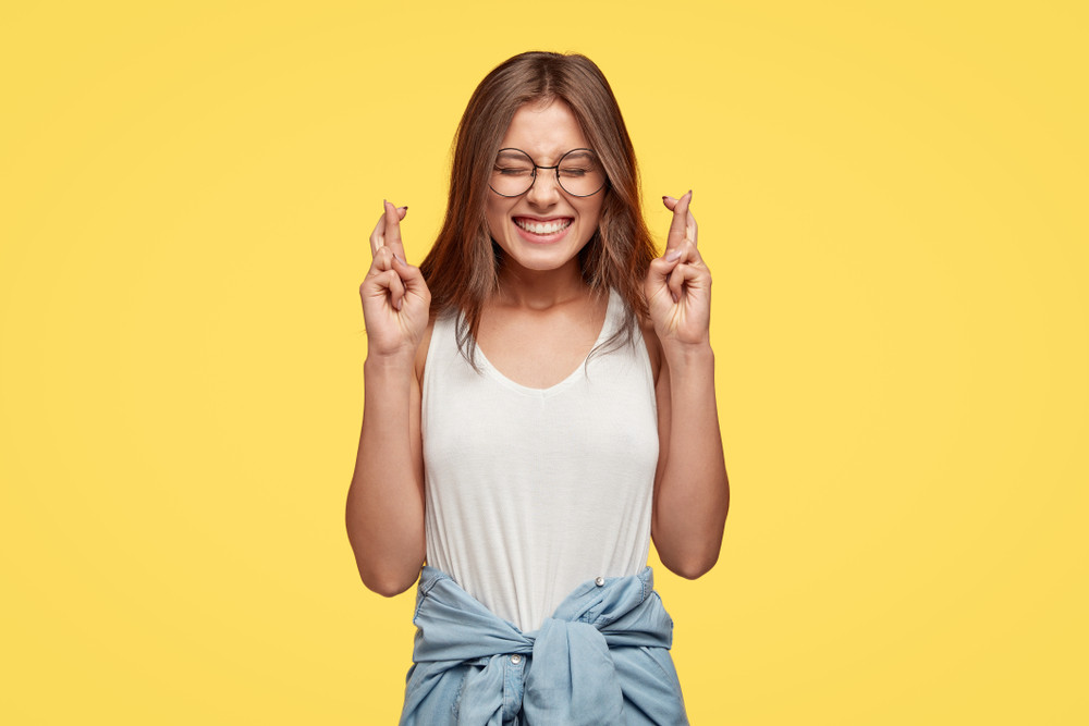 Teenage girl smiling confidently in a stylish outfit.