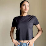 Black bamboo crop top showcasing minimalist style and comfortable fit, ideal for everyday wear.