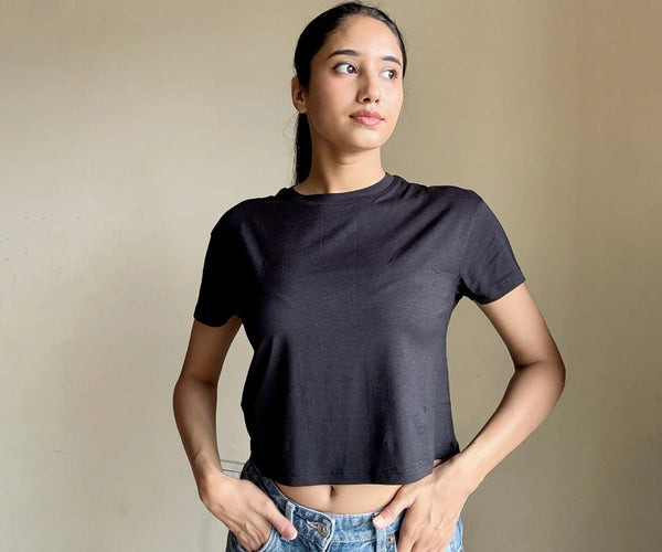 Black bamboo crop top showcasing minimalist style and comfortable fit, ideal for everyday wear.