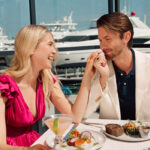 Outdoor seating at a Fashion Island restaurant with ocean views.