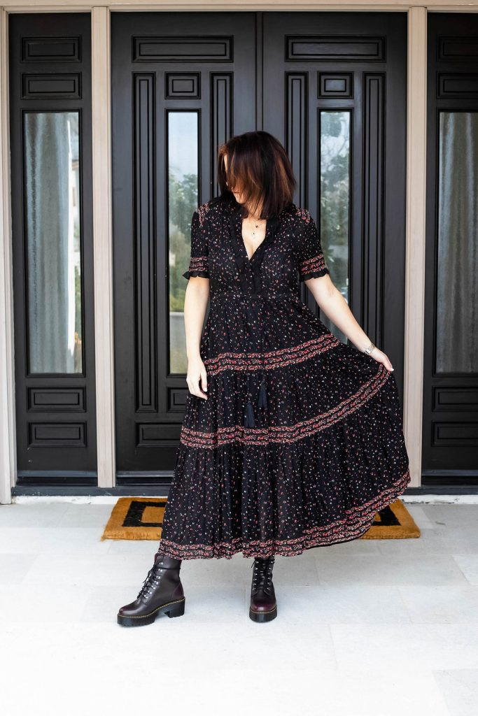 Midlife women wearing Free people maxi dress with Dr. Martens.