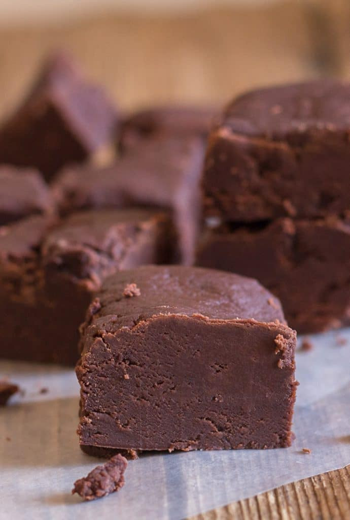 Fudge pieces on parchment paper.