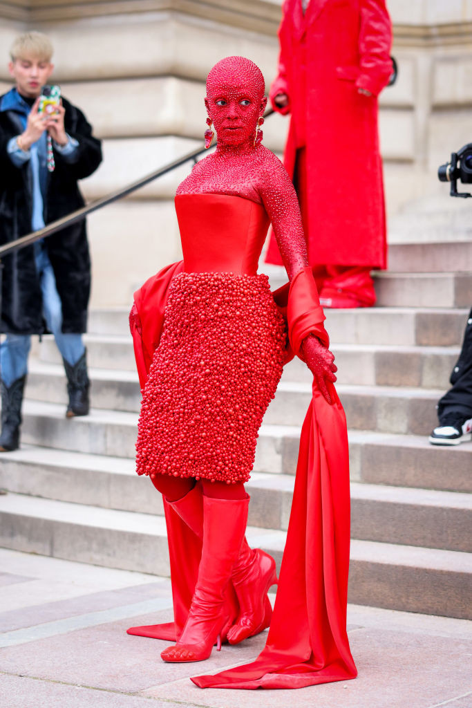 Doja Cat at Schiaparelli's Spring 2023 couture show covered in red crystals.