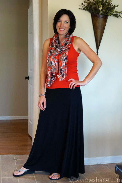 Woman wearing a black jersey knit maxi skirt