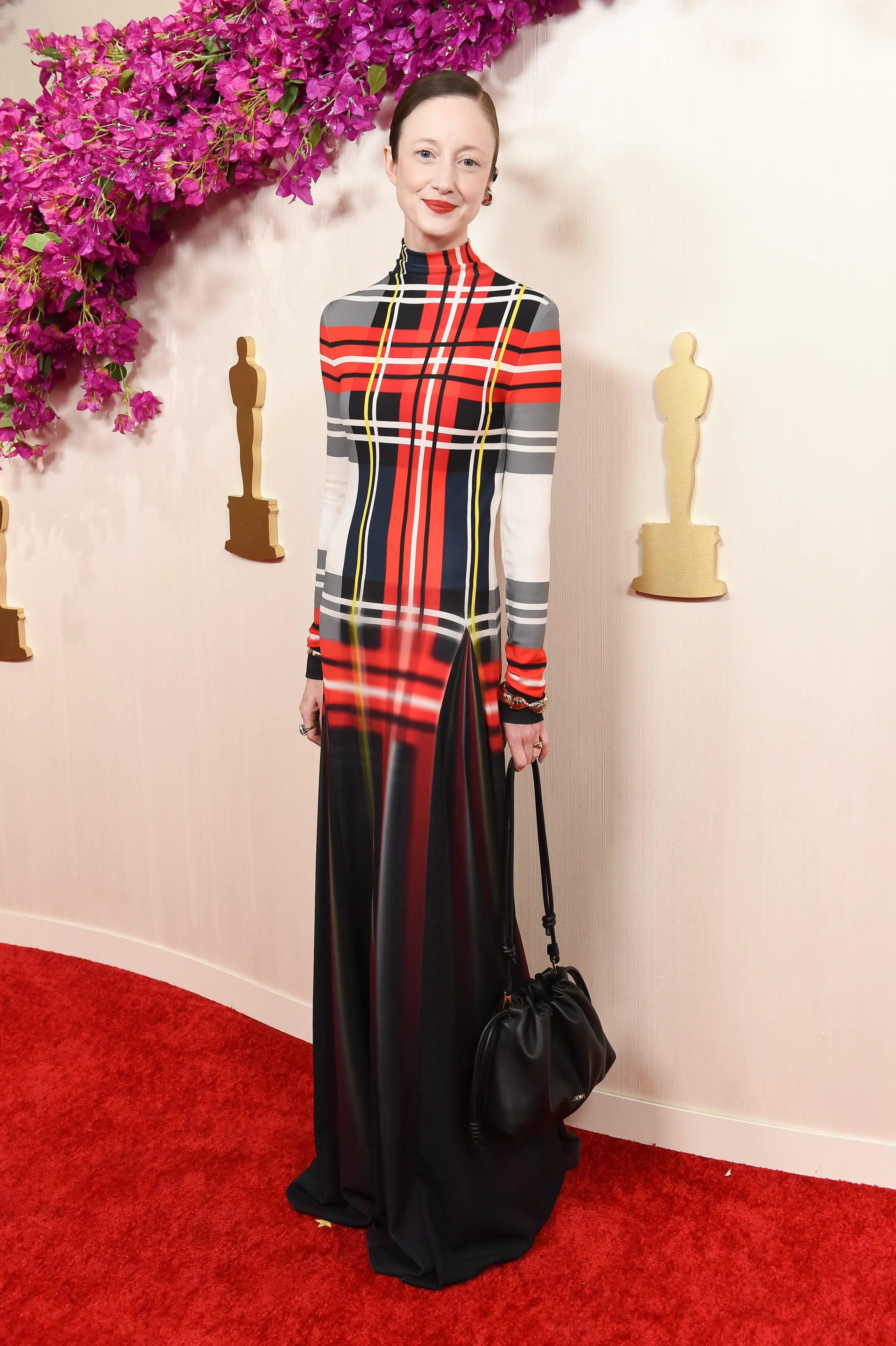 Andrea Riseborough in a Loewe tartan print gown at the 2024 Oscars.