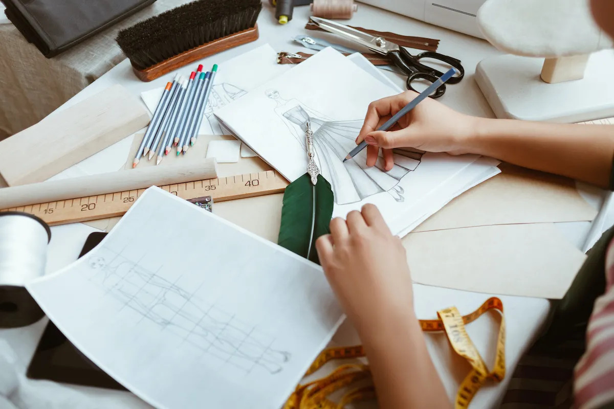 Fashion design sketches and tools at Pearl Academy, New Delhi, illustrating the industry-focused and technology-integrated curriculum offered by top fashion colleges in India.