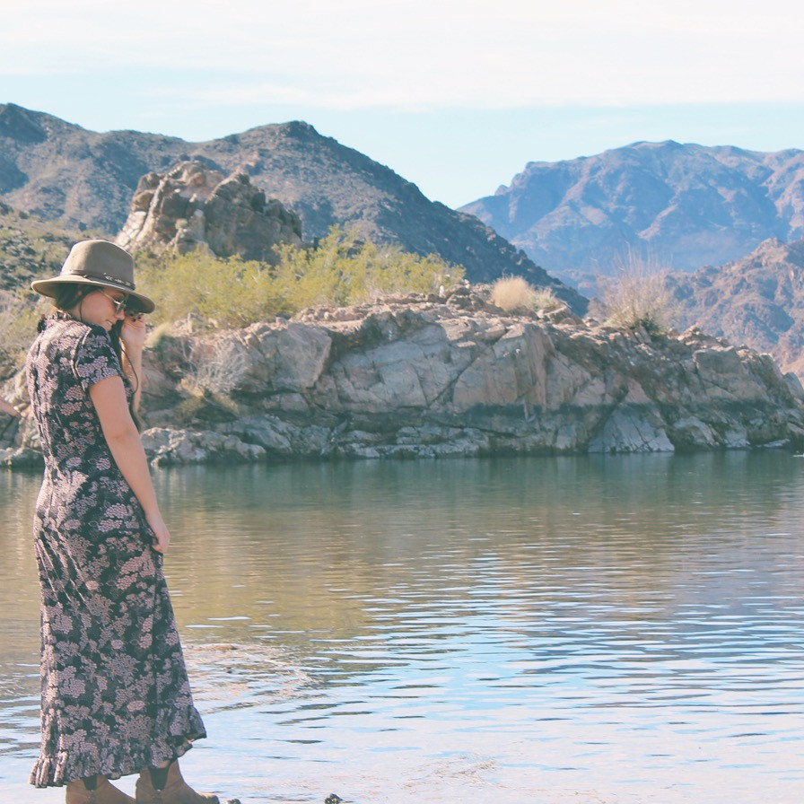 Woman wearing a vintage dress in a desert landscape in Nevada.