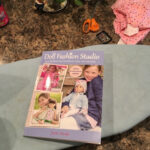 Sewing book with pattern sheets and sewing tools