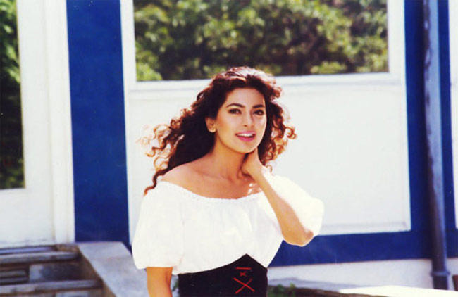 Juhi Chawla in a charming off-shoulder top from the Bollywood movie Darr, showcasing 90s fashion trends and elegant style.