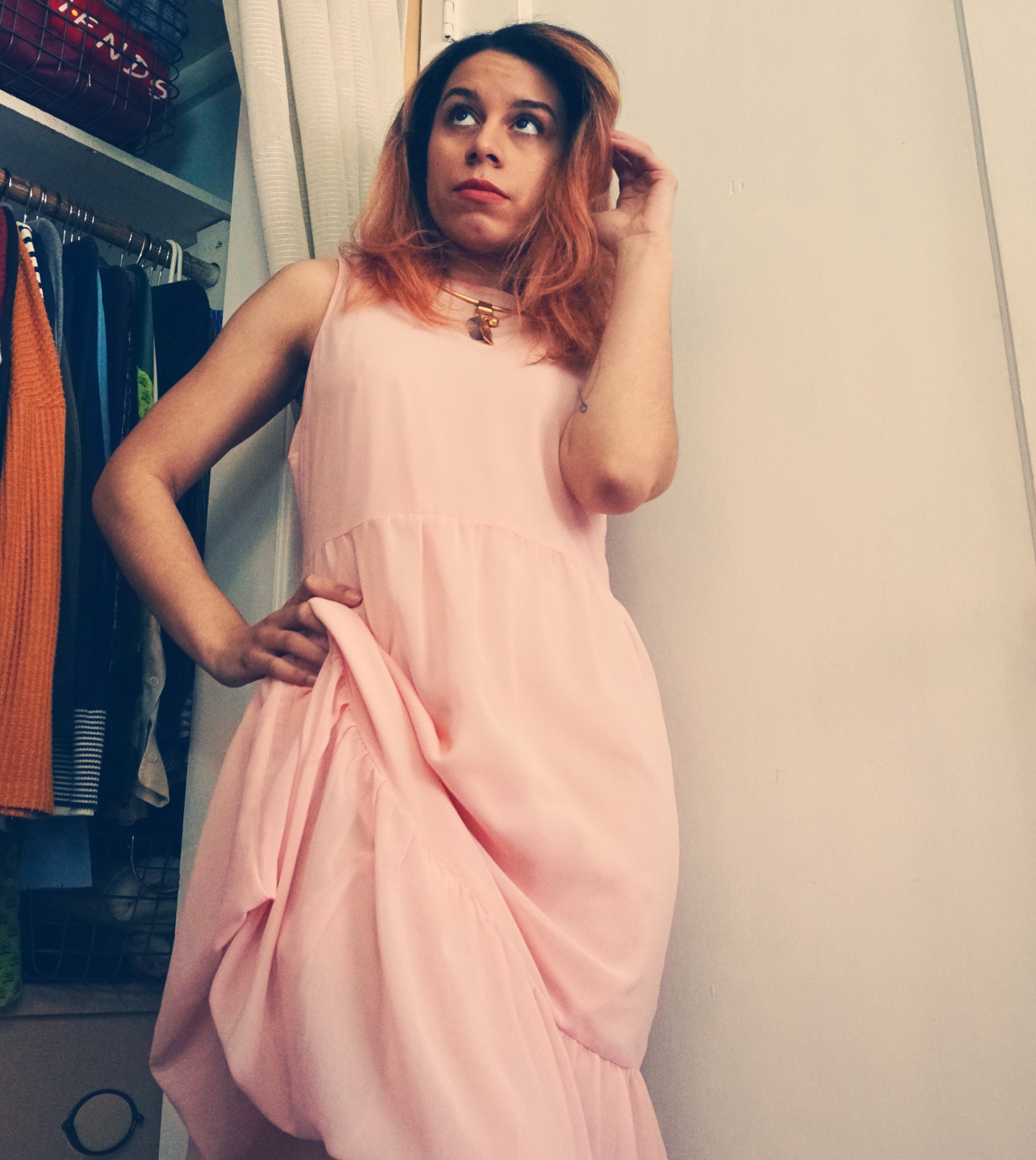 60's fashion style: Sandy from Last Night in Soho in a peach mini dress.