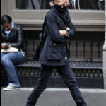 Meg Ryan wearing black combat boots with a casual outfit.