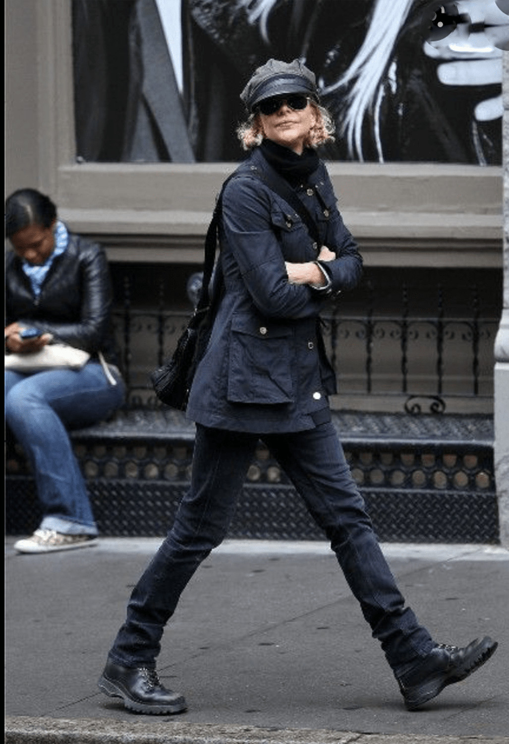 Meg Ryan wearing black combat boots with a casual outfit.