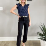 Polka dot navy top with black jeans.