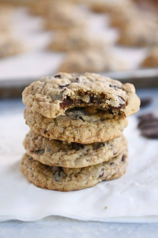 Oatmeal chocolate chip cookies on a white napkin.