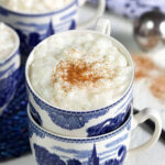 Classic rice pudding served in stacked blue and white teacups.