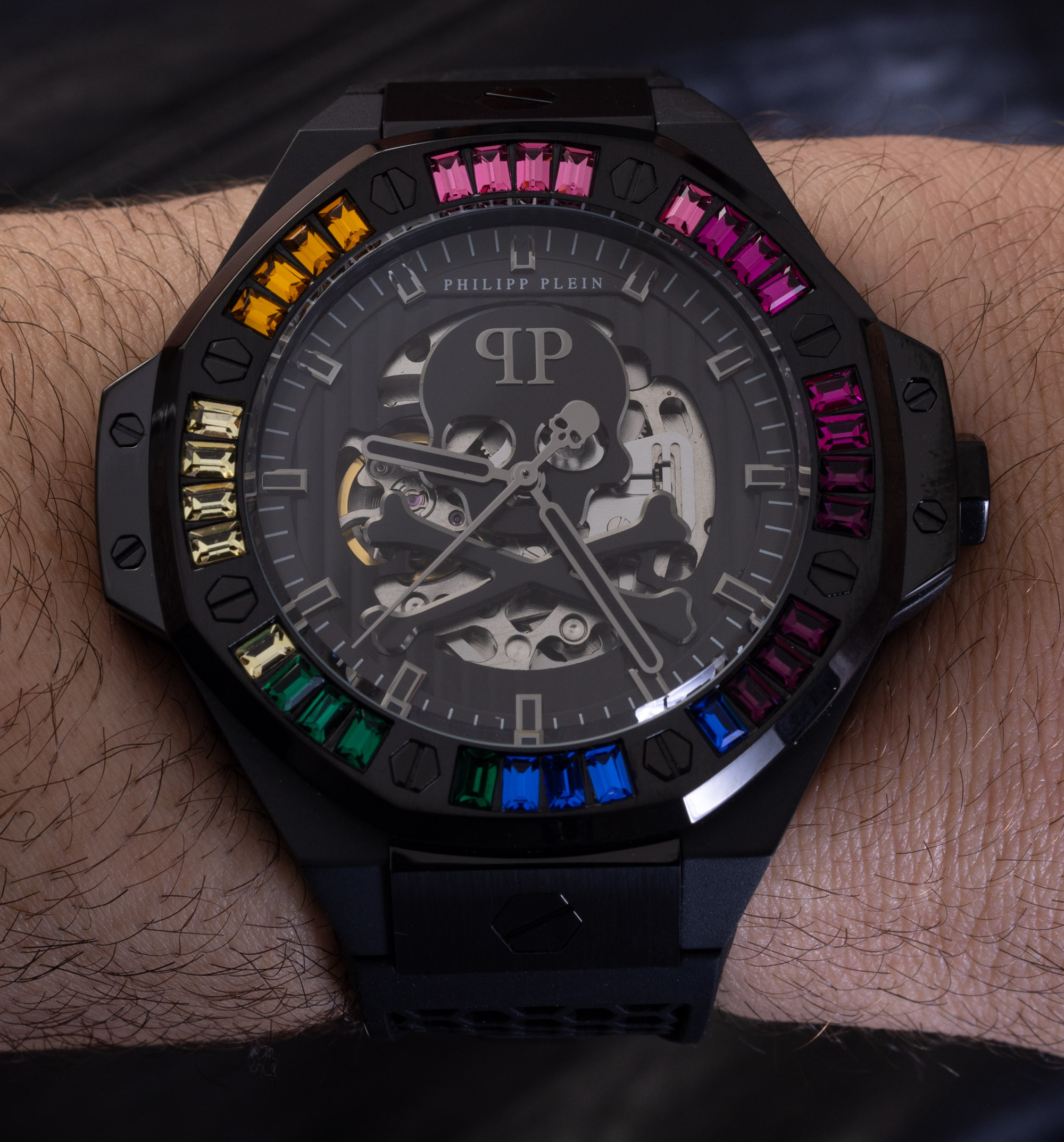 Close-up of Philipp Plein Skeleton Royal Automatic watch showcasing the rainbow bezel and skull details on the dial.