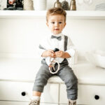 Toddler boy with a textured hairstyle and fade.