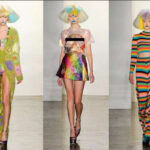 Models wear different multi-colored outfits on the runway