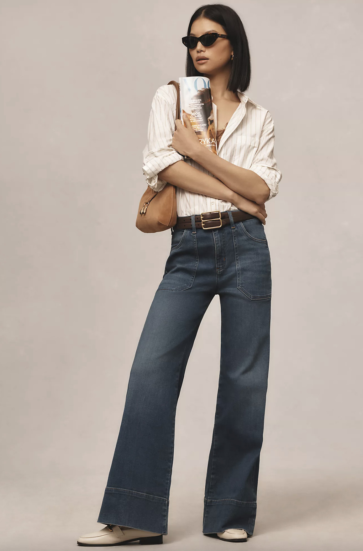 Wide leg jeans outfit idea for fall fashion trends, featuring a stylish woman in wide leg denim and a neutral top.