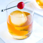 Classic Old Fashioned Cocktail in a rocks glass with orange peel garnish