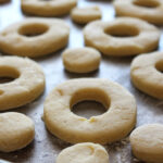 Unbaked sour cream donut dough, ready to be cut into shapes.