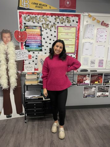 Mrs. Langenwalter in a stylish pink sweater and cream loafers.