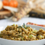 Cornbread dressing in a white bowl.