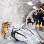 Zero gravity fashion photoshoot preparation with silver foil.