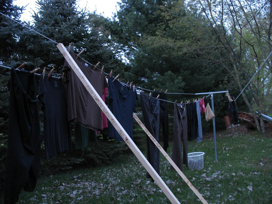 Old-fashioned clothesline with wooden poles and laundry