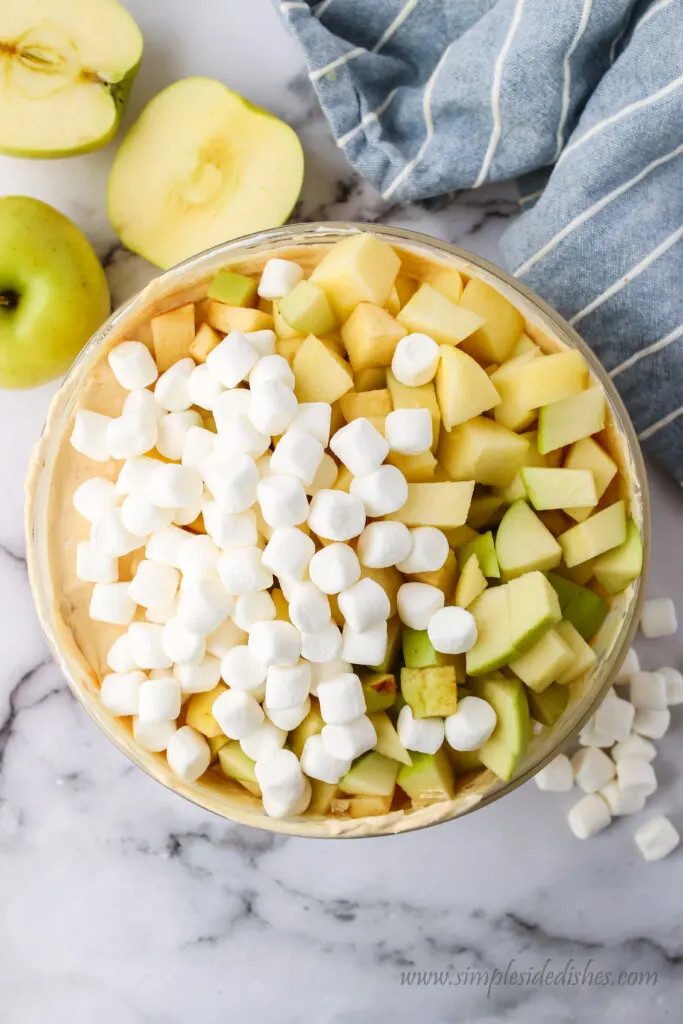 Apples and marshmallows mixed into the fluff mixture
