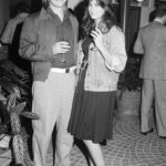 Demi Moore and Freddy Moore attending the "Summer Lovers" premiere party in 1982, showcasing early 80s fashion trends.