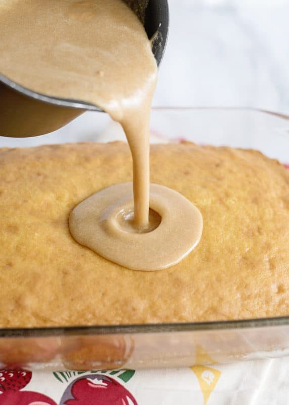 Pouring icing onto cake