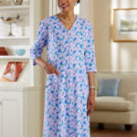 Woman in floral zip-front knit dress