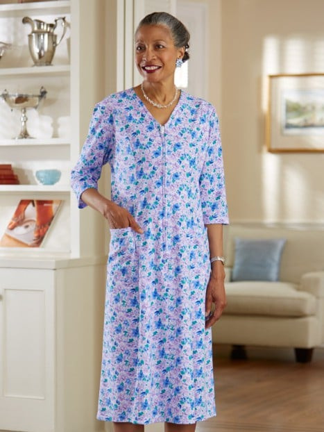 Woman in floral zip-front knit dress