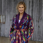 Lauren Hutton wearing a white top and black blazer