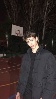 Man showcasing the Starboy aesthetic with a black leather jacket and sleek hairstyle