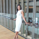 Fashionista showing her white dress with a bow