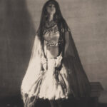 Ruth St. Denis by Baron Adolf De Meyer, showcasing his soft-focus style and artistic approach to fashion photography